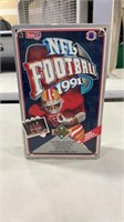 Lot of football cards factory sealed in box.