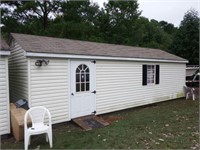 12’x28’ Vinyl sided shed with 9’ garage door,