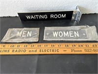 Retro bathroom waiting room signs.