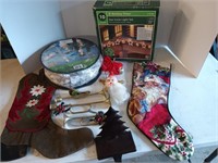 Box of assorted Christmas lights, stockings, decor
