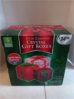 Set of three lighted crystal gift boxes