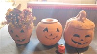 3 pottery pumpkins. 1 has a broke lid