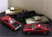 A lot of five die cast cars and trucks - all