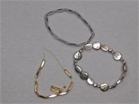 Two silvertone link bracelets - goldtone with
