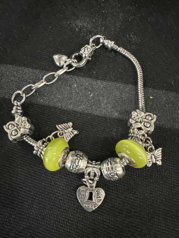 Neat little silver charm bracelet with green