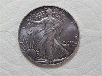 1987 Silver Eagle Dollar with Toning