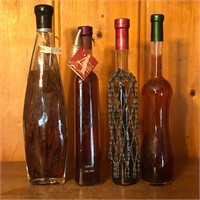 (4) Sealed Tall Glass Bottles