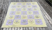 HOMEMADE QUILT WITH TULIP PATTERN