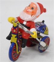 Vintage Santa Claus Riding A Metal Trike Toy