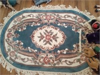 Oval floral rug, 60" x 37"