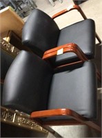 2 black padded wooden chairs cherry vinyl