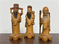 Three Diminutive Chinese Carved Wooden Immortals