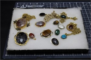Mixed Broaches & Necklaces In Display Case