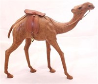 Leather clad camel figurine