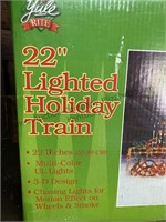 Lighted holiday train assumed complete indoor