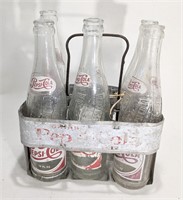Lot Pepsi bottles and carrier