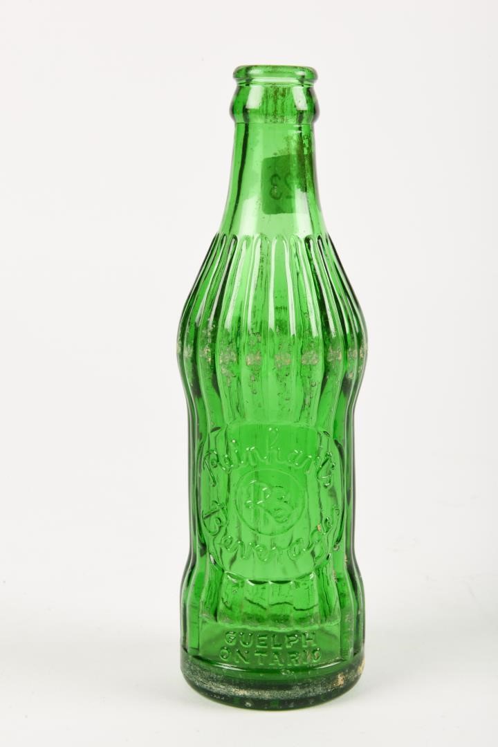 REINHARTS BEVERAGES EMBOSSED GREEN GLASS BOTTLE