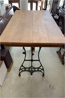 Antique iron base oak top table, the sides of a