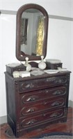 Four drawer walnut chest with carved pulls, two