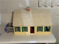 Toy Dollhouse With Some Accessories