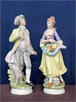 Vintage porcelain figurines holding fruit
