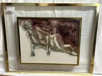 Double framed art of woman laying down signed