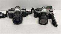(2) Canon AE-1 cameras with added lens