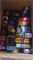 24 small hand held radios various brands and