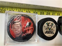 Hockey pucks and opeechee mug