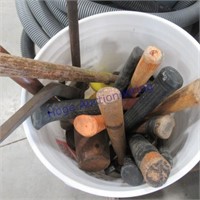Bucket of assorted hammers