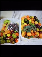 2 containers of artificial fruits