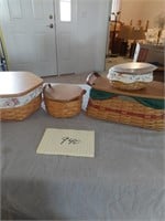 Four Longaberger baskets with wooden
