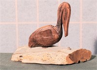 1975 wooden pelican on drift wood