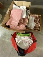 box of bath towels; curtains; tote bags