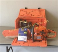 Husqvarna chainsaw with case and oil. Not tested.