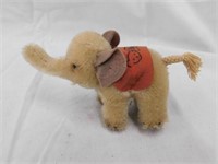 Small Steiff elephant with tusks and braided tail