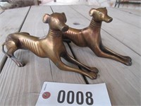 Unmarked pair of lying dog bronze