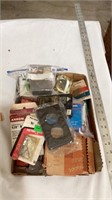 Staples, picture hangers, outlet covers, hinges,