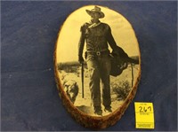 John Wayne picture on wood slab