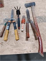 Assorted gardening tools and axe