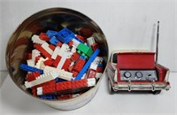 (AM) Lot of Tin of Legos & Chevy End Radio