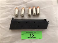 45 caliber gun clip with five bullets