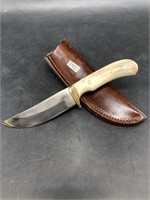 Hunting knife with antler handle and leather sheat