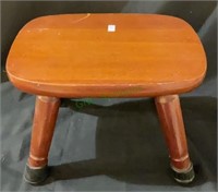 Hardwood footstool with rubber foot pads