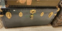 Antique shipping trunk with leather side handles,