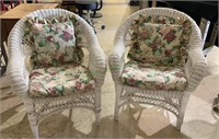 One pair of round back wicker arm chairs with