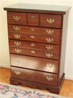 Cherry finished five drawer chest of drawers with