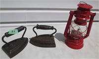 2 sad irons and a lantern