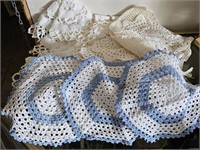 Group of handcrafted doilies and runners