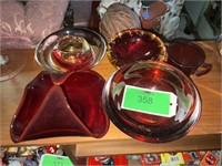 Five pieces of red glass